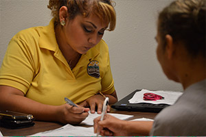 Community Health Worker helps someone enroll