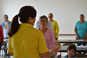 A CHW leads a health education class